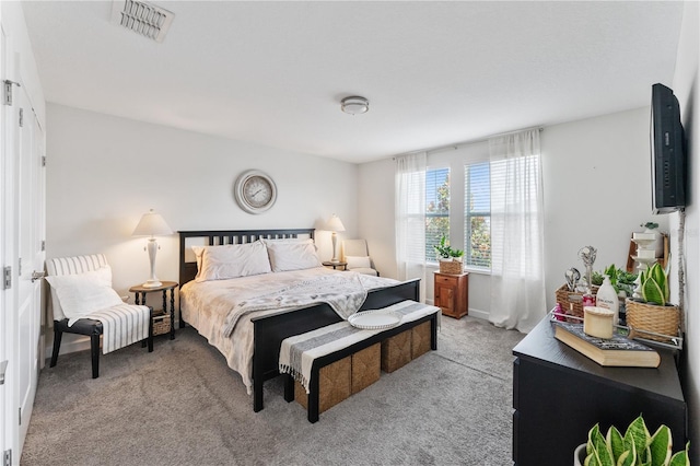 bedroom featuring light carpet