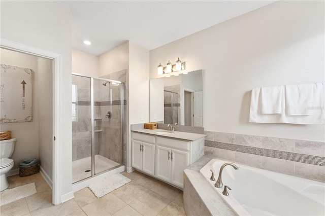 full bathroom featuring vanity, toilet, tile patterned floors, and separate shower and tub