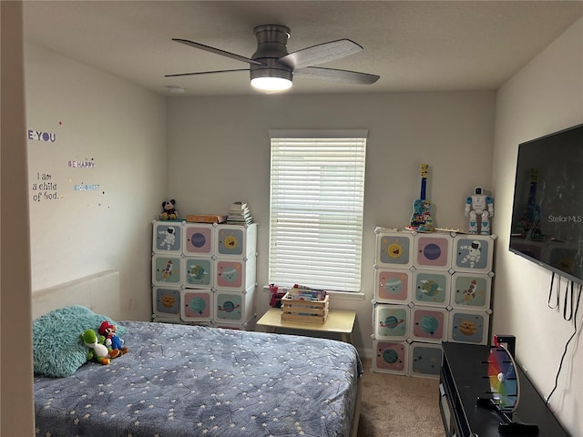 bedroom with ceiling fan and carpet