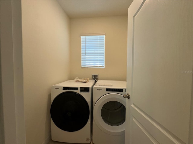 washroom featuring independent washer and dryer