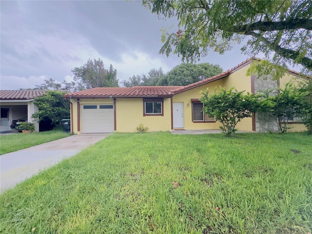 view of front of house featuring a front lawn and a garage