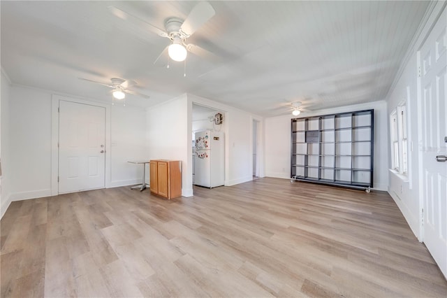 interior space featuring light hardwood / wood-style flooring, ceiling fan, and crown molding