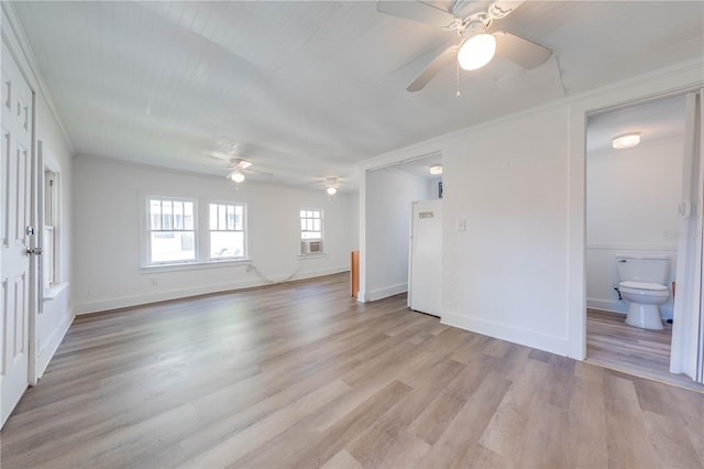 interior space with light hardwood / wood-style flooring, ceiling fan, cooling unit, and crown molding