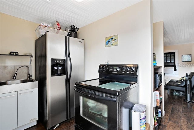 kitchen featuring sink, dark hardwood / wood-style flooring, white cabinetry, black / electric stove, and stainless steel fridge with ice dispenser