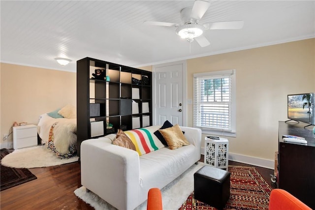 living room featuring crown molding, dark hardwood / wood-style flooring, and ceiling fan