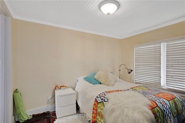 bedroom with crown molding