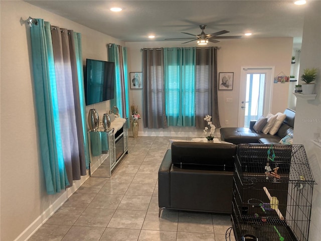 tiled living room with ceiling fan