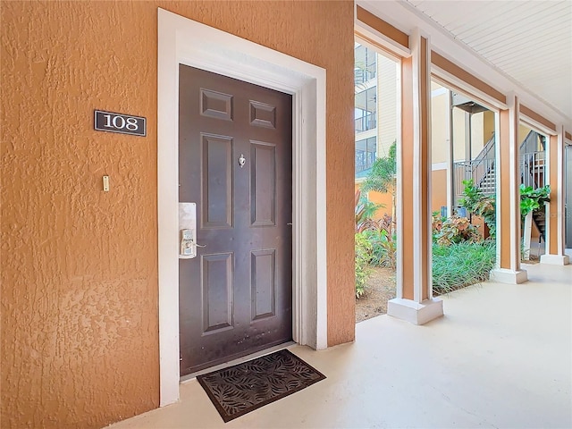 doorway to property with a porch