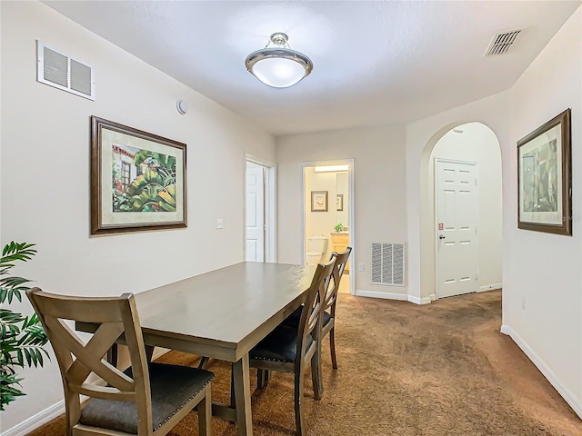 view of carpeted dining space