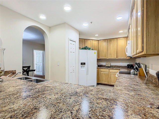 kitchen with sink, white appliances, and light tile patterned floors