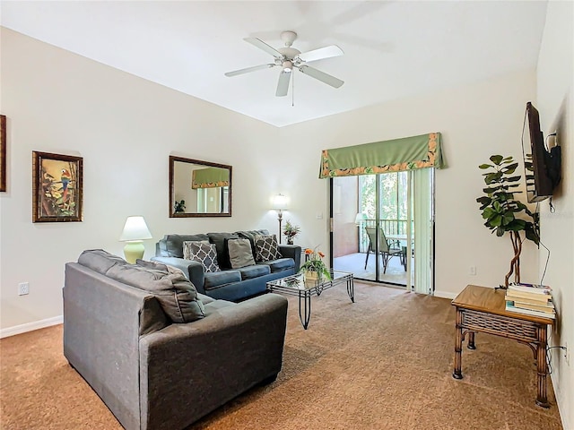 carpeted living room with ceiling fan