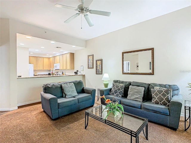 living room with light carpet and ceiling fan