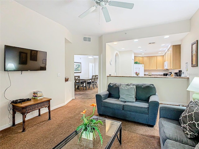 living room with light carpet and ceiling fan