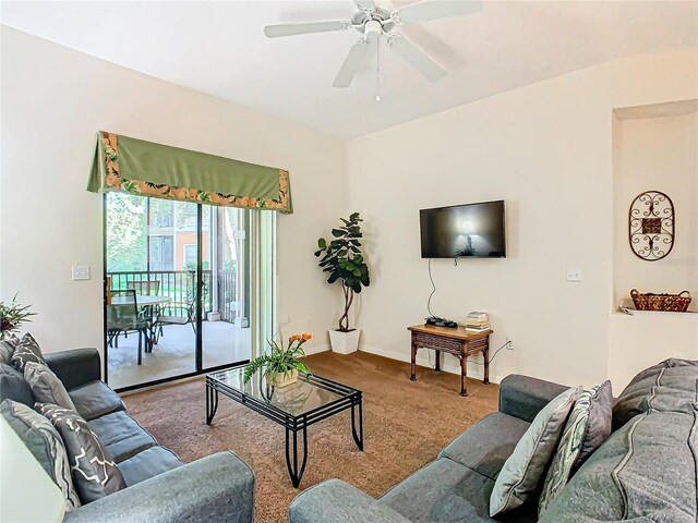 living room with ceiling fan and carpet flooring