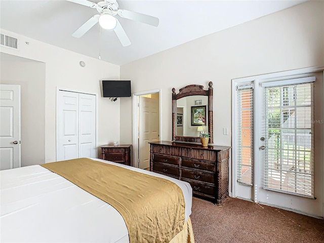 bedroom with a closet, ceiling fan, carpet floors, and access to exterior