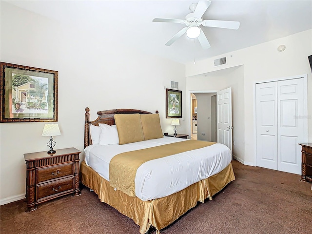 bedroom with dark colored carpet, a closet, and ceiling fan