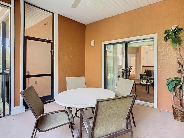 sunroom featuring ceiling fan