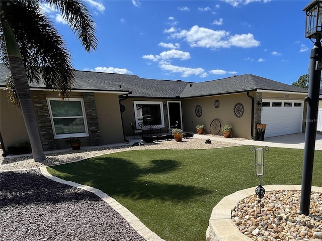 ranch-style house with a front yard and a garage