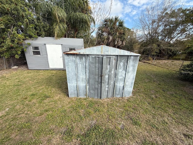 view of shed with fence