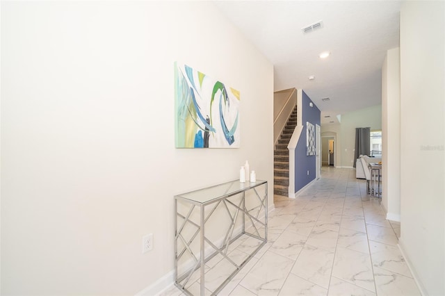 corridor featuring vaulted ceiling