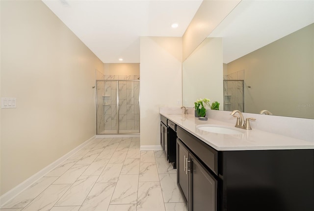 bathroom with vanity and a shower with shower door