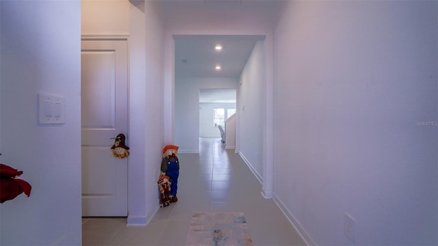 corridor featuring light tile patterned floors