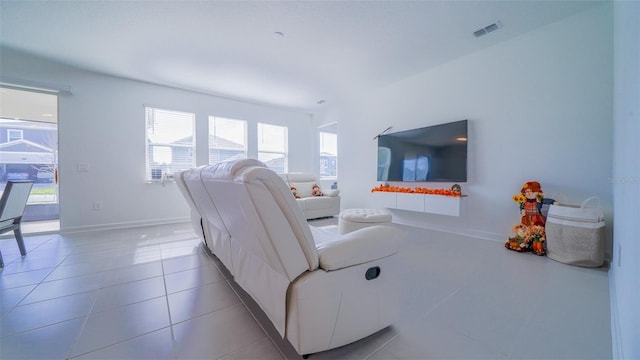 living room with tile patterned floors