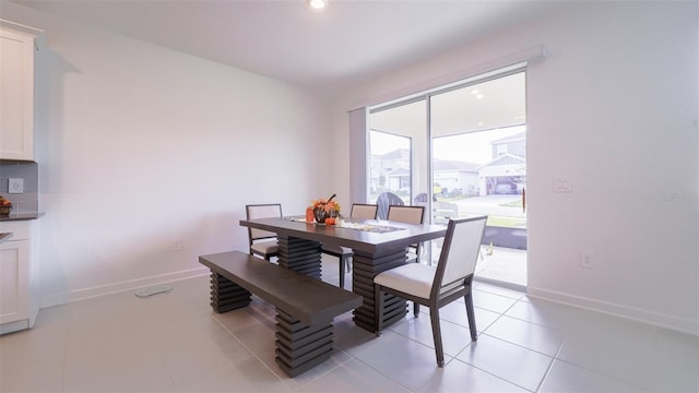 dining space with light tile patterned floors