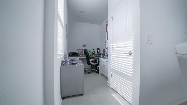 office space with light tile patterned flooring