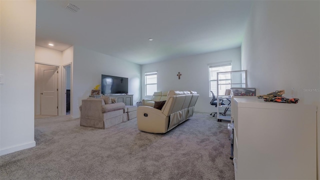 carpeted living room featuring a wealth of natural light