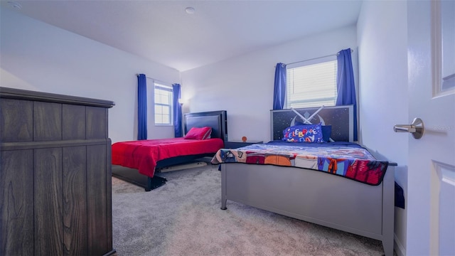 carpeted bedroom with lofted ceiling