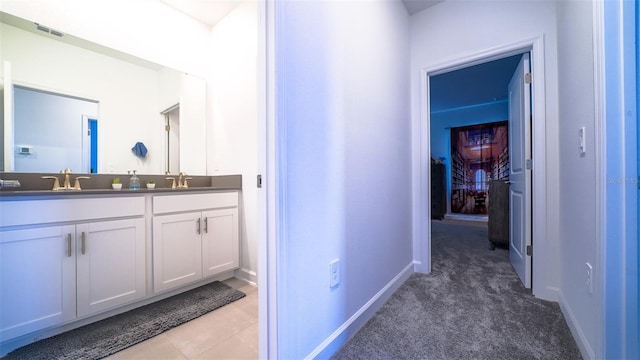 bathroom with vanity and tile patterned floors