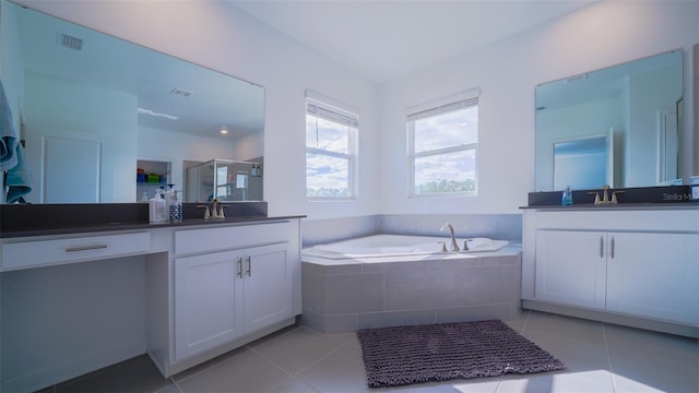 bathroom featuring vanity, independent shower and bath, and tile patterned floors