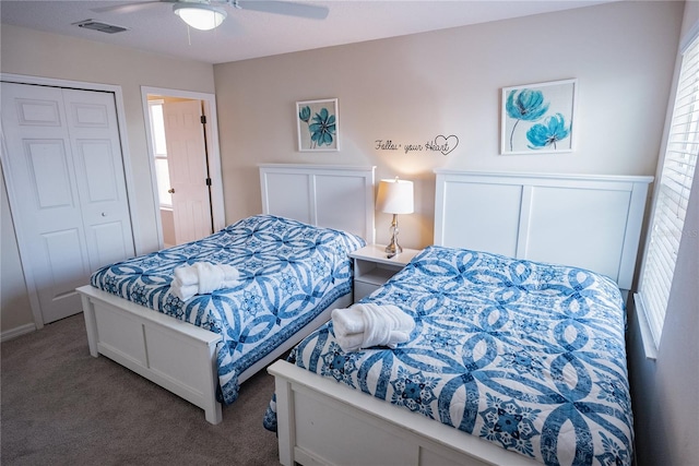 bedroom with multiple windows, a closet, carpet flooring, and ceiling fan