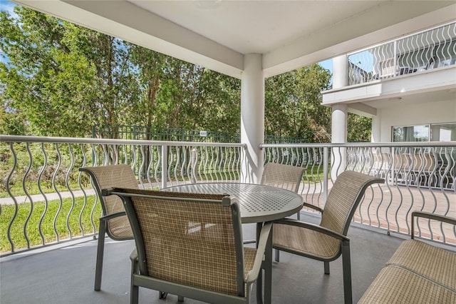 balcony featuring outdoor dining space