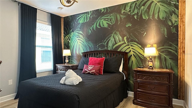 bedroom with light wood-type flooring