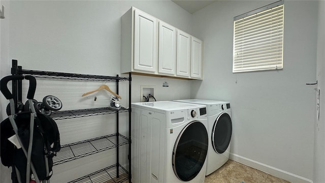 laundry area featuring cabinets and independent washer and dryer