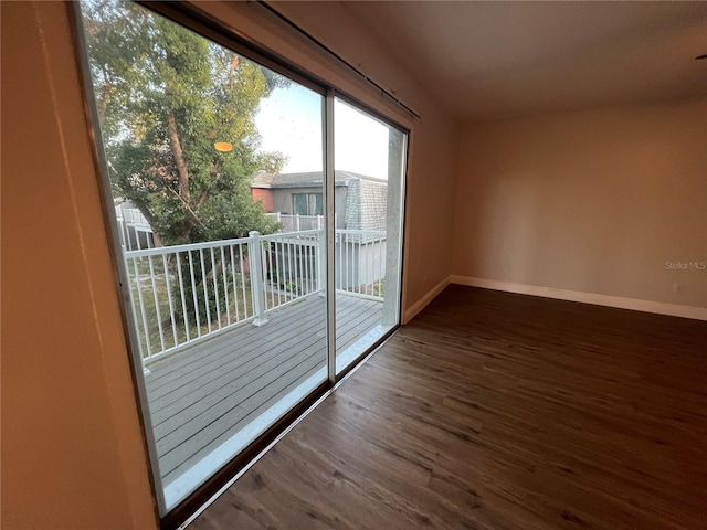 entryway featuring wood finished floors and baseboards