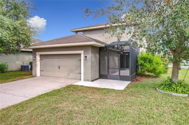 back of property featuring central air condition unit, a lawn, and a garage