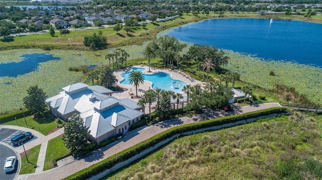 birds eye view of property with a water view