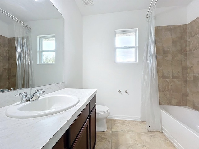 full bathroom with shower / tub combo with curtain, vanity, and toilet