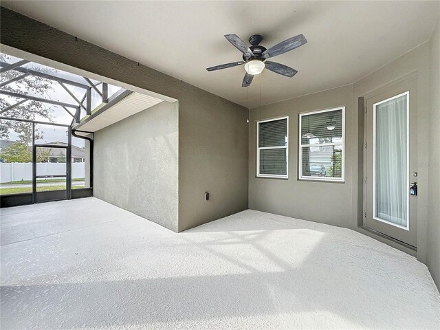 view of patio / terrace with a lanai and ceiling fan