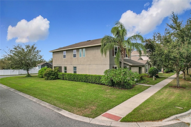 view of side of home featuring a lawn