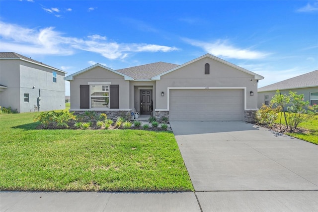 view of front of property with a front lawn and a garage