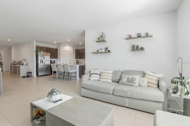 living room featuring light tile patterned flooring