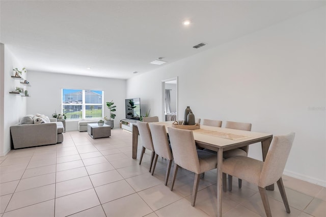 dining area with light tile patterned flooring