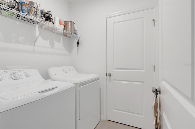 laundry room with independent washer and dryer