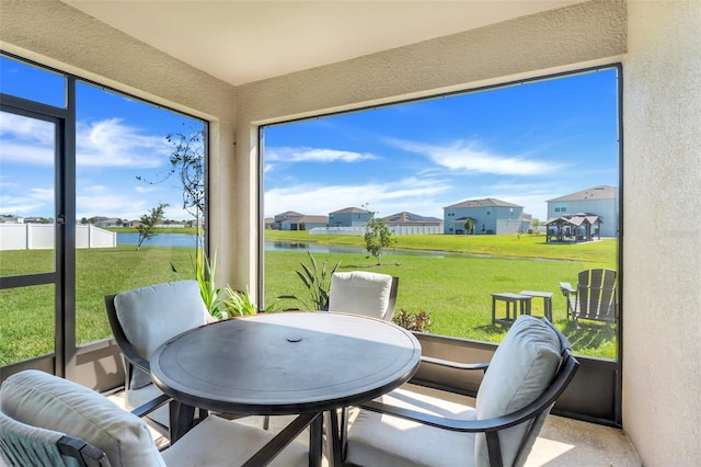 sunroom with a water view