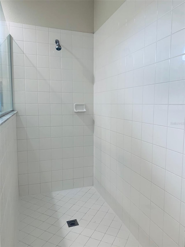 bathroom with tiled shower