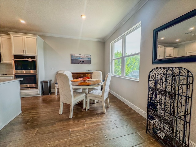 dining space with crown molding, a textured ceiling, and dark hardwood / wood-style flooring